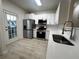 Modern kitchen with stainless steel appliances and white cabinets at 137 St Ann Cir, Dallas, GA 30157