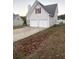 Two-story house with two-car garage and landscaped lawn at 137 St Ann Cir, Dallas, GA 30157