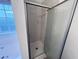 Clean shower with marble-look tile and glass enclosure at 137 St Ann Cir, Dallas, GA 30157