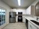 Modern kitchen with stainless steel appliances and white cabinets at 137 St Ann Cir, Dallas, GA 30157