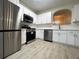 Modern kitchen with stainless steel appliances and white cabinets at 137 St Ann Cir, Dallas, GA 30157