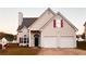 Two-story house with two-car garage and landscaped lawn at 137 St Ann Cir, Dallas, GA 30157