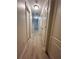 Long hallway with light walls and wood flooring at 137 St Ann Cir, Dallas, GA 30157