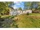 View of the back of the house and a detached structure at 3838 Collier Nw Dr, Atlanta, GA 30331