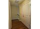 Upstairs hallway with wood flooring and storage at 363 Lobdale Falls Dr, Lawrenceville, GA 30045