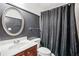 Simple bathroom with updated vanity and black shower curtain at 600 Treetops Ct, Canton, GA 30115