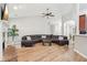 Spacious living room featuring a large curved sectional sofa and a cozy fireplace at 600 Treetops Ct, Canton, GA 30115