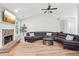 Living room with sectional sofa, fireplace, and hardwood floors at 600 Treetops Ct, Canton, GA 30115