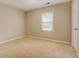 Bedroom with neutral carpet and single window at 1187 Dixie Rd, Covington, GA 30014