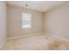 Simple bedroom with neutral walls and carpeted floor at 1187 Dixie Rd, Covington, GA 30014