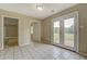 Bright bonus room with French doors leading to backyard at 1187 Dixie Rd, Covington, GA 30014