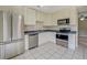 Kitchen with stainless steel appliances and view of living room at 1187 Dixie Rd, Covington, GA 30014