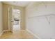 Laundry room with tile flooring and kitchen access at 1187 Dixie Rd, Covington, GA 30014