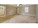 Living room with carpet, ceiling fan and access to hallway at 1187 Dixie Rd, Covington, GA 30014
