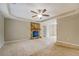 Spacious living room with stone fireplace and ceiling fan at 1187 Dixie Rd, Covington, GA 30014