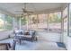 Relaxing sunroom with wicker furniture and wooded views at 2555 Woodbrook Ct, Lawrenceville, GA 30043