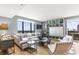 Modern living room with hardwood floors and city views at 75 14Th Ne St # 3560, Atlanta, GA 30309