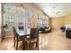 Bright dining area with hardwood floors and access to deck at 803 Cork Oak Ln, Lawrenceville, GA 30045