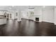 Open concept living room and kitchen with hardwood floors and fireplace at 962 Rittenhouse Way, Atlanta, GA 30316