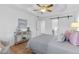 Bright bedroom with hardwood floors and ceiling fan at 7065 Walnut Mill Ct, Cumming, GA 30040