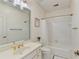 Bathroom with a shower/tub combo, updated vanity, and large mirror at 709 Henley Fields Cir, Johns Creek, GA 30097