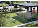 Outdoor entertainment area with stage, seating, and artificial turf at 172 Railroad St, Canton, GA 30114