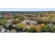 Wide aerial view of the community and surrounding area, showcasing autumn foliage at 5356 Brooke Ridge Dr, Dunwoody, GA 30338