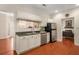 Modern kitchen with white cabinets, dark countertops, and stainless steel appliances at 5356 Brooke Ridge Dr, Dunwoody, GA 30338