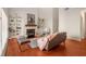 Spacious living room with hardwood floors, fireplace, built-in shelves and large windows at 5356 Brooke Ridge Dr, Dunwoody, GA 30338