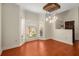 Dining area with hardwood floors, large windows and unique light fixture at 5356 Brooke Ridge Dr, Dunwoody, GA 30338