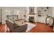 Living room features a fireplace, built-in shelving, and hardwood floors at 5356 Brooke Ridge Dr, Dunwoody, GA 30338