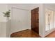 Bright entryway with hardwood floors, built-in storage, and wood door at 5356 Brooke Ridge Dr, Dunwoody, GA 30338