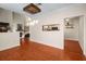 Open dining area with hardwood floors, kitchen view, and unique lighting at 5356 Brooke Ridge Dr, Dunwoody, GA 30338