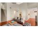 Open living area with hardwood floors, gray couch, and view of kitchen at 5356 Brooke Ridge Dr, Dunwoody, GA 30338