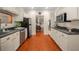 Eat-in kitchen with white cabinets, granite countertops, and stainless steel appliances at 5356 Brooke Ridge Dr, Dunwoody, GA 30338
