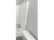 Shower stall with white tile and chrome fixtures at 5876 Poplin Ct, Lithonia, GA 30058