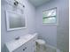 Clean bathroom featuring a vanity, toilet and shower at 535 Lake Dr, Hapeville, GA 30354