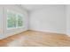 Bright bedroom with hardwood floors and large windows at 4333 Rickenbacker Ne Way, Atlanta, GA 30342