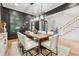 Bright dining room with large wooden table and white chairs at 4333 Rickenbacker Ne Way, Atlanta, GA 30342