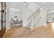 Bright entryway with hardwood floors, staircase, and view to living area at 4333 Rickenbacker Ne Way, Atlanta, GA 30342