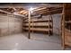 Unfinished basement with concrete floors and shelving for storage at 2545 Winthrope Way, Lawrenceville, GA 30044