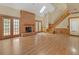 Gathering room with hardwood floors, brick fireplace and access to a deck at 2545 Winthrope Way, Lawrenceville, GA 30044