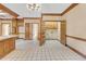 Kitchen with wood cabinets, tile floor and pantry at 2545 Winthrope Way, Lawrenceville, GA 30044