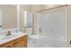 Clean bathroom with a shower/tub combo and wood vanity at 2545 Winthrope Way, Lawrenceville, GA 30044