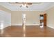 Main bedroom with hardwood floors and access to the bathroom and kitchen at 2545 Winthrope Way, Lawrenceville, GA 30044