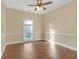 Spacious bedroom featuring wood-look floors and a ceiling fan at 2545 Winthrope Way, Lawrenceville, GA 30044