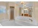 Primary bathroom with a large soaking tub and double sinks at 2545 Winthrope Way, Lawrenceville, GA 30044