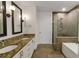 Spa-like bathroom with double vanity, soaking tub, and walk-in shower at 270 17Th Nw St # 1108, Atlanta, GA 30363