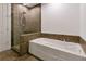 Relaxing bathroom with soaking tub and glass-enclosed shower at 270 17Th Nw St # 1108, Atlanta, GA 30363
