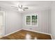 Bedroom with hardwood floors and wainscoting at 2804 Dearwood Sw Dr, Atlanta, GA 30315